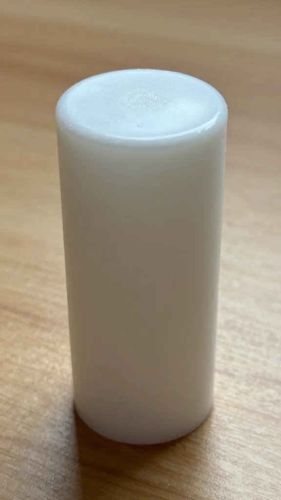 macro detail of washable glue stick with smooth plastic casing on tabletop